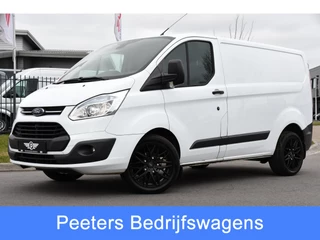 Hoofdafbeelding Ford Transit Custom Ford Transit Custom 2.2 TDCI L1H1 Black & White Edition Cruise, Airco, Trekhaak, 100pk, 2 x Stoel, Voorruit verwarming, Uniek!