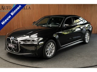 Hoofdafbeelding BMW i4 BMW i4 eDrive40 84 kWh M-pakket Navi Leer Elektr. achterklep 360° Camera Co-pilot Climate voor & achter Zwarte hemelbekleding PDC LM velgen BTW auto