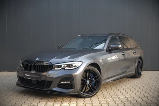 Hoofdafbeelding BMW 3 Serie BMW 3 Serie Touring 330e High Executive M Sport | M Performance | PDC | Leer | Hifi | Ambiance Verlichting | Stoelverwarming | Adaptive Cruise Control | BTW | LED | Shadow Line | Keyless | Navigatie Prof. | DAB | Elek. Trekhaak