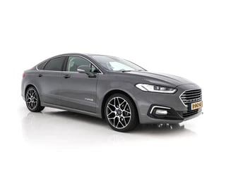 Hoofdafbeelding Ford Mondeo Ford Mondeo 2.0 IVCT HEV Titanium (INCL-BTW) *VOLLEDER | FULL-LED | BLIND-SPOT | SONY-AUDIO | MEMORY-PACK | LANE-ASSIST | ADAPTIVE-CRUISE | CAMERA | KEYLESS | NAVI-FULLMAP | ECC | PDC | COMFORT-SEATS | 19"ALU*