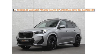 BMW X1 18i M-Sport | Panorama | Sportstoelen | Keyless-Entry | Sfeerverlichting | Achteruitrij-Camera | 5x op voorraad! | Carplay | Full-LED | Black-Optic | Getint Glas | Stoelverwarming | Draadloos Laden |