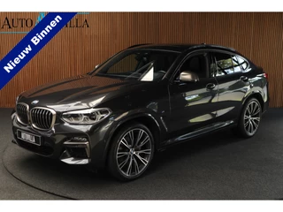Hoofdafbeelding BMW X4 BMW X4 M40i HUD Panodak 360° Harman K Leer ACC Navi Keyless Entry & Go Elektr. uitklapbare trekhaak Elektr. bedienbare achterklep Memory seats Climate voor & achter PDC Zwarte hemelbekleding 21 inch LM v