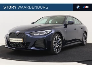 Hoofdafbeelding BMW i4 BMW i4 eDrive40 High Executive M Sport / BMW M 50 Jahre uitvoering / Schuif-kanteldak / Trekhaak / M Adaptief onderstel / Parking Assistant Plus / Active Cruise Control / Comfort Access / Alcantara Hemelbekleding