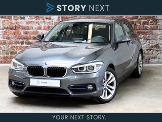 BMW 1 Serie 118i Executive Sport Line Automaat 5 deurs / Navigatie Professional / LED / Trekhaak / Climate Control / 17 Inch / Bluetooth / Sportstoelen / Parkeersensoren / Lichtpakket / Cruise Control / Stoelverwarming / Neerklapbare Achterbank