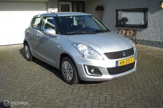 Hoofdafbeelding Suzuki Swift Suzuki Swift 1.2 Style EASSS Airco Cruise Nieuwe APK