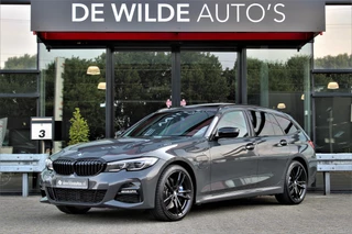 Hoofdafbeelding BMW 3 Serie BMW 3 Serie Touring 330e M-sport 292pk Dravitgrijs Pano Harman/Kardon Head-up Laser Camera
