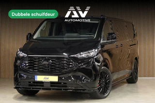 Hoofdafbeelding Ford E-Transit Custom Ford E-Transit Custom 320 L2H1 Limited 65 kWh 218 PK | 328 KM Range | ACC | Blind Spot | L+R Schuifdeur | LED Koplampen + achterlichten | Stuur- en stoelverwarming | CarPlay | Camera | Zero Emission