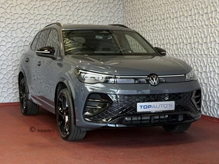 Hoofdafbeelding Volkswagen Tiguan Volkswagen Tiguan 1.5 eHYBRID 272 PK NW AUTO R-LINE VW.TREKHAAK BLACK PANO XL.NAVI STOEL/STUUR VERW. BLACK.STYLE 360.CAM ELEK.KLEP MATRIX.LED 20''LMV MASSAGE SCHUIFDAK PHEV PLUG IN HYBRID ✅Top Auto's Wijchen , 30 Jaar Specialist in Volkswagen  : Alle Type's : R-Line Edition / Style / First Edition / Highline / Life , Zowel PHEV / HEV / MHEV / Benzine ✅