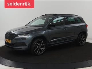 Skoda Karoq 1.5 TSI Sportline | Panoramadak | Trekhaak |  Stoelverwarming | Camera | Carplay | Virtual Cockpit | Canton Sound | 19'' | Parkeerhulp | Navigatie | Sfeerverlichting | Cruise control | Stuurverwarming