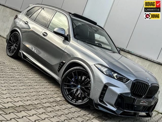 Hoofdafbeelding BMW X5 BMW X5 50e 490Pk M-sport Performance 22Inch Skycrap H&K 360Cam