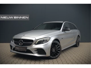 Hoofdafbeelding Mercedes-Benz C-Klasse Mercedes-Benz C-Klasse Estate 300 e Business Solution AMG | Burmester | Carbon | Memory Seats | Keyless | Ambiance Verlichting | 360 Camera | Stoelverwarming | Massage | Adaptive Cruise Control | LED | Head-Up Display | Apple Carplay | Trekhaak | HU