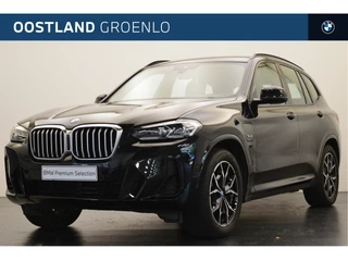 Hoofdafbeelding BMW X3 BMW X3 xDrive30e High Executive M Sport Automaat / Trekhaak / Sportstoelen / Stoelverwarming / Parking Assistant / Adaptieve LED / Live Cockpit Professional / Verwarmd stuurwiel