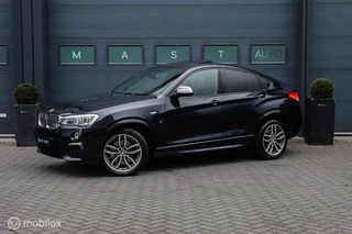 Hoofdafbeelding BMW X4 BMW X4 M40i High Executive|HUD|H&K|Schuifdak|Leder|Camera