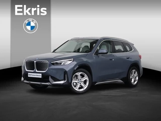Hoofdafbeelding BMW iX1 BMW iX1 eDrive20 67 kWh Nieuw/ X-Line/ Verwarmd Stuurwiel/ Sportstoelen/ Harman-Kardon/ Elektrische Trekhaak/ Achteruitrijcamera/ Stoelverwarming