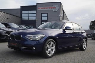 BMW 1-serie 118i Upgrade Edition | Automaat | Schuifdak | Luxe SPORT Leder | Navigatie | Airco | 5 deurs | Xenon | NAP |