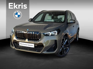 BMW iX1 eDrive20 | M Sportpakket Pro | Travel Pack | Verwarmd Stuurwiel | Comfort Access | Achteruitrijcamera | Panoramadak | Harman-Kardon | Stoelverwarming | 21''