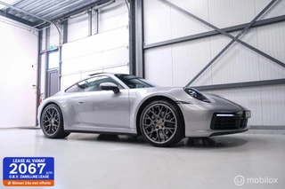 Hoofdafbeelding Porsche 911 Porsche 911 Coupe 3.0 Carrera | GT Silver | 992 | Schuifdak | 503PK 600NM | Apple carplay | Spyder RS velgen