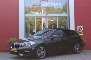 BMW 1-serie 118i 140PK AUTOMAAT EXECUTIVE EDITION | PANORAMISCH SCHUIF/KANTELKDAK | AFNEEMBARE TREKHAAK | DRAADLOZE TELEFOONLADER | DRAADLOZE APPLE CARPLAY/ANDROID AUTO | NAVIGATIE | ACHTERUITRIJ CAMERA | PARKEERSENSOREN VOOR EN ACHTER | CRUISE CONTROL | FULL LED KOPLAMPEN | CLIMATE CONTROL | ALL SEASON BANDEN | 17" LICHTMETALEN VELGEN |