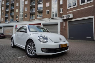 Volkswagen Beetle 1.2 TSI Exclusive Allstar | LEER | NAVI | XENON + LED | Parkeersensoren voor en achter | Volledige historie (boekjes + onderhoudsuitdraai dealer)