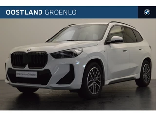 Hoofdafbeelding BMW X1 BMW X1 sDrive20i High Executive M Sport Automaat / Panoramadak / Sportstoelen / Stoelverwarming / Adaptieve LED / Parking Assistant / Harman Kardon / Adaptief M Onderstel