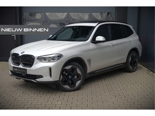 BMW iX3 High Executive 80 kWh | Panoramadak | Keyless | Stoelverwarming | Harman Kardon | Memory Seat | Head-Up Display | 360 Camera | Adaptief Onderstel | Trekhaak | Adaptive LED | Elektrische Stoelen | Apple Carplay | N