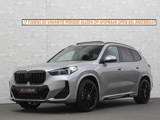 BMW X1 18i M-Sport | Panorama | Sportstoelen | Keyless-Entry | Sfeerverlichting | Achteruitrij-Camera | 5x op voorraad! | Carplay | Full-LED | Black-Optic | Getint Glas | Stoelverwarming | Draadloos Laden |