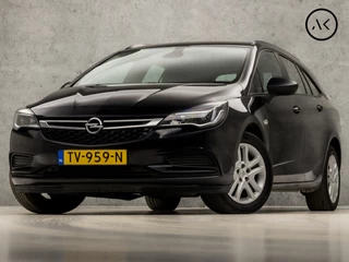 Opel Astra Sports Tourer 1.0 Turbo Online Edition (APPLE CARPLAY, GROOT NAVI, PARKEERSENSOREN, SPORTSTOELEN, CRUISE, ARMSTEUN, TREKHAAK, NIEUWE APK, NIEUWSTAAT)