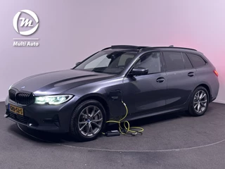 BMW 3 Serie Touring 330e Sportline Plug in Hybrid PHEV | Trekhaak af Fabriek | Panodak | Laser Led | Adaptive Cruise | Head-up Display | Carplay | Sportstoelen Verwarmd |