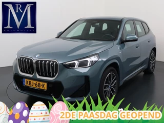 BMW iX1 xDrive30 67 kWh VAN € 41.900,- VOOR € 38.440,- UW LENTEVOORDEEL: € 3.460,-!| M-SPORT| COMPLEET | SOH 99% | ELEK. ACHTERKLEP |STOELVERWARMING| ACHTERUITRIJCAMERA| COMFORT ACCESS| APPLE CARPLAY/ ANDROID AUTO|