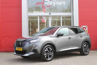 Hoofdafbeelding Peugeot 2008 Peugeot 2008 1.2 100PK ALLURE PACK | TREKHAAK | NAVIGATIE | APPLE CARPLAY/ANDROID AUTO | 3-D INSTRUMENTENPANEEL | ACHTERUITRIJ CAMERA | CRUISE CONTROL | LED KOPLAMPEN | CLIMATE CONTROL | 17" LICHTMETALEN VELGEN | DAB+ RADIO |