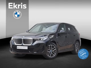 BMW iX1 eDrive20 | M Sportpakket | Panodak | Trekhaak | Getint Glas | Camera | Sportstoelen | Adaptief Onderstel | 18'' LMV