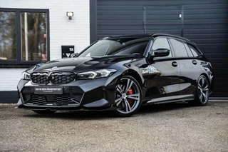 BMW 3-serie Touring 330e M Zetels Pano H&K HU Trekhaak