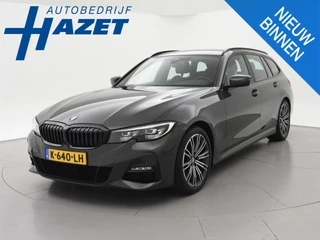 BMW 3-serie Touring 318i AUT. M-SPORT DRAVITGRAU + SPORTSTOELEN | CAMERA | MEMORY | HIFI | SFEERVERLICHTING | CARPLAY