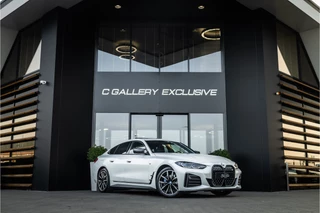 Hoofdafbeelding BMW i4 BMW i4 M50 High Executive 84 kWh - M Sport | Panorama | Carbon | 360 Camera | Sportstoelen