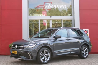 Volkswagen Tiguan 1.4 TSI 245PK eHybrid R-LINE BUSINESS + | BEKLEDING LEDER VIENNA | PANORAMISCH SCHUIF/KANTEL DAK | ELEKTRISCH WEGKLAPENBARE TREKHAAK | R-LINE INTERIEUR/EXTERIEUR | VERWARMBARE VOORSTOELEN/STUUR | ELEKTRISCH BEDIENBARE VOORSTOELEN MET GEHEUGEN FUNCTIE | AKOESTISCH GLAS GETINT | KEYLESS ACCESS/START | ELEKTRISCH BEDIENABRE ACHTERKLEP | DAKSPOILER R-LINE | SFEER VERLICHTING | RIJASSISTENT PAKKET O.A. LANE ASSIST EN ADAPTIVE CRUISE CONTROL EN DODEHOEK DETECTIE | NAVIGATIE | APPLE CARPLAY/ANDROID AUTO | DAB+ RADIO | LED MATRIX KOPLAMPEN (IQ LIGHT) | DRAADLOZE TELEFOONLADER | DIGITAAL DASHBOARD | 360° CAMERA | CLIMA CONTROL VOOR EN ACHTERIN |