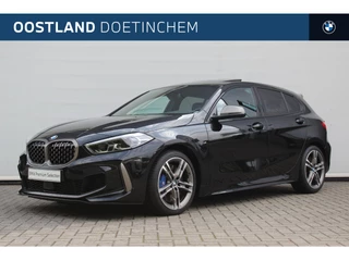 Hoofdafbeelding BMW 1 Serie BMW 1 Serie M135i xDrive Automaat / Panoramadak / Active Cruise Control / Comfort Access / Live Cockpit Professional / Stoelverwarming