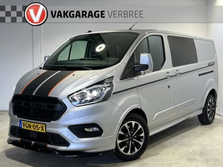 Hoofdafbeelding Ford Transit Custom Ford Transit Custom 320 2.0 TDCI L2H1 Sport | Navigatie/Android/Apple Carplay | LM Velgen 17" | Voorstoelen Verwarmd | Trekhaak | PDC Voor en Achter | Achteruitrijcamera |