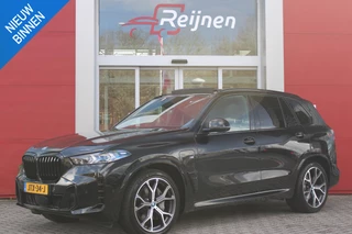 BMW X5 xDrive50e 490PK M-SPORT LAUNCH EDITION | PANORAMA SCHUIF/KANTEL DAK "SKY LOUNGE" | COMFORT STOELEN ELEKTRISCH VERSTELBAAR MET GEHEUGENFUNCTIE EN VERWARMBAAR VOOR EN ACHTER | LEDEREN BEKLEDING BMW INDIVIDUAL ZWART | EDELHOUT INTERIEURLIJSTEN | RIJASSISTENT-SYSTEEM DRIVING ASSISTANT PROFFESIONAL MET O.A. DODEHOEK DETECTIE EN ADAPTIVE CRUISE CONTROL | TRAVEL PAKKET | INNOVATIE-PAKKET: PARKEERASSISTENT-PAKKET PROFESSIONAL/ADAPTIEVE LED KOPLAMPEN/HARMAN/KARDON AUDIO SYSTEM/BMW LIVE PROFESSIONAL/RIJASSISTEN-SYSTEEM BMW GESTURE CONTROL/RIJSTROOK ASSISTENT/RIJSTROOKWISSEL ASSISTENT/BOTSWAARSCHUWING/RIJASSISTENT ACHTERBOTSING | DRAADLOZE APPLE CARPLAY/ANDROID AUTO | NAVIGATIE | 360° CAMERA | GEKOELDE BEKERHOUDERS | LUCHTVERING | DRAADLOZE TELEFOONLADER | ELEKTRISCH BEDIENBARE ACHTERKLEP | HEAD UP DISPLAY |