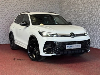 Hoofdafbeelding Volkswagen Tiguan Volkswagen Tiguan 1.5 eTSI R-LINE 3D LED GRILL 19''LMV ERGO.STOEL MASSAGE ELEK.KLEP DESIGN PACK STOEL/STUUR VERW TREKHAAK 09/2024 "Volkswagen rijden begint bij Topautos.nl – 75 topmodellen direct op voorraad!"