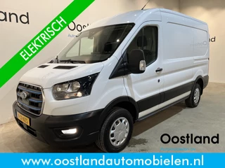 Hoofdafbeelding Ford E-Transit Ford E-Transit 390 (3500 kg) L2H2 Trend 68 kWh / 100% Elektrisch !! / Airco / Cruise Control / CarPlay / Camera / Navigatie / 3-Zits / 13.850 KM !!